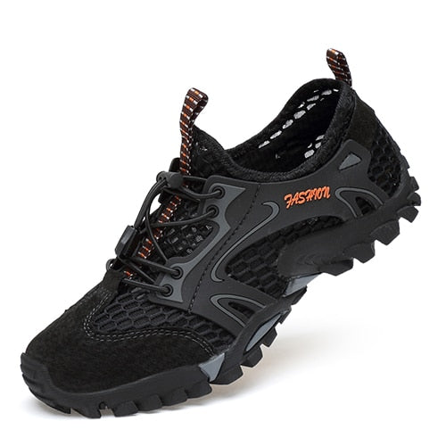 The Mens Summer Breathable Hiking Shoes by eprolo are black outdoor sneakers with a rugged non-slip outsole, mesh design for breathability, a unique lacing system, an orange FASHION label on the side, and a heel pull tab for easy wear.