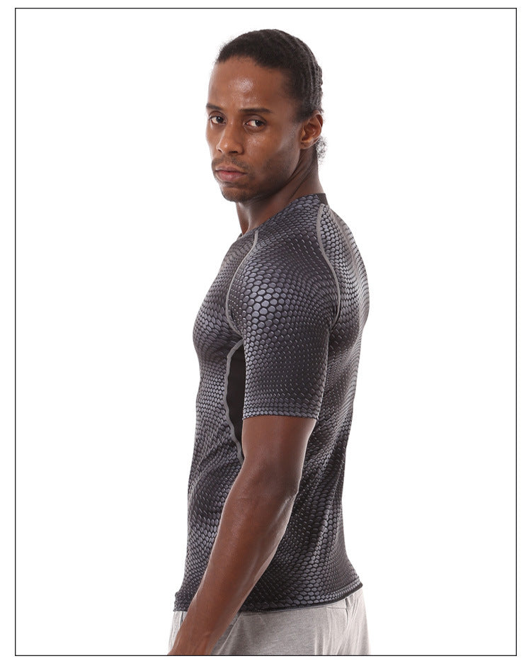 A man with braided hair wears an eprolo Mens Quick-Dry Serpentine Athletic Fit Compression T-Shirt for hiking and outdoor activities. He pairs it with light pants, standing against a white background and looking over his shoulder with a serious expression.
