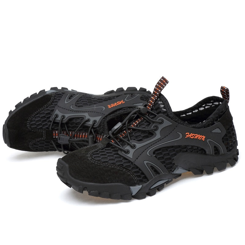 Eprolos Mens Summer Breathable Hiking Shoes are minimalist outdoor sneakers with black mesh and synthetic overlays. They have non-slip outsoles, quick-dry tech, black laces, a pull-tab at the heel, and Fashion in orange on the side.
