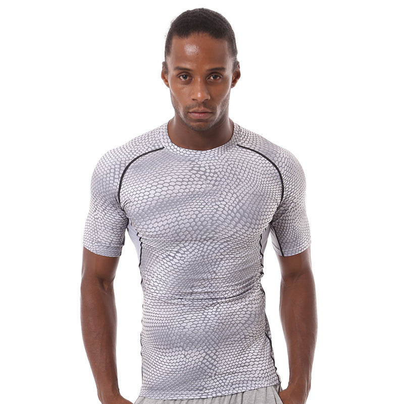A man stands against a white background wearing an eprolo Mens Quick-Dry Serpentine Athletic Fit Compression T-Shirt, designed for hiking and outdoor activities.