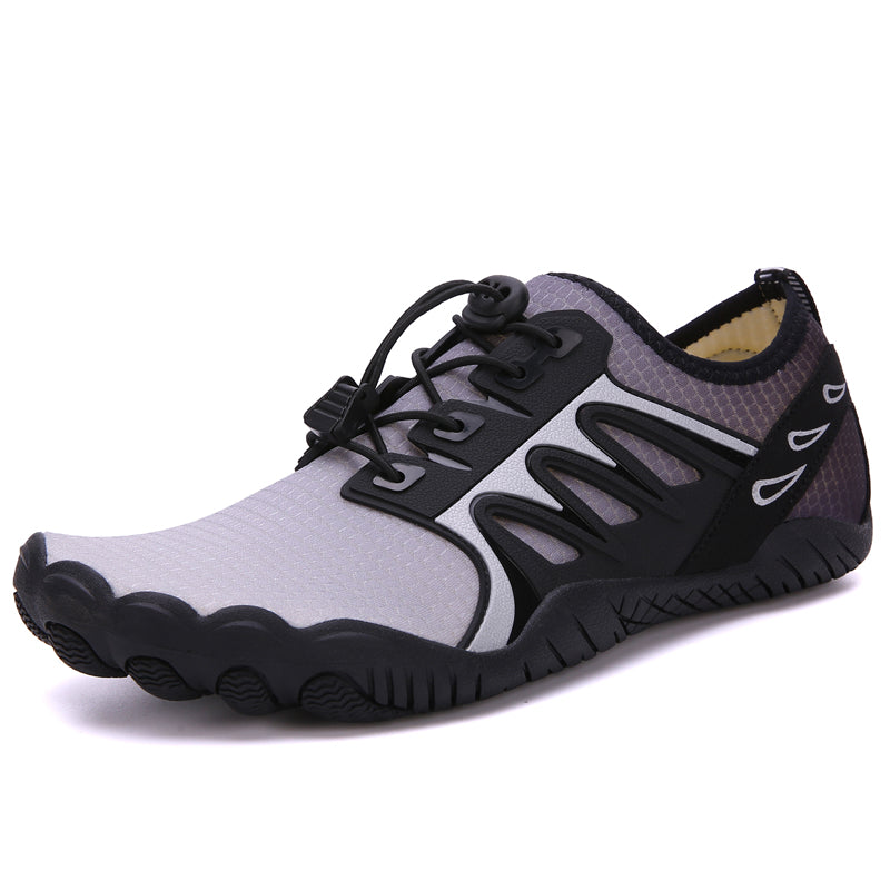 The Modalyst Barefoot Quick Dry Beach Pool Aqua Shoes for men are minimalist athletic footwear featuring gray and black wave patterns, adjustable elastic laces, and a textured rubber sole. Lightweight for running or hiking and ideal for water activities with quick-drying capability.