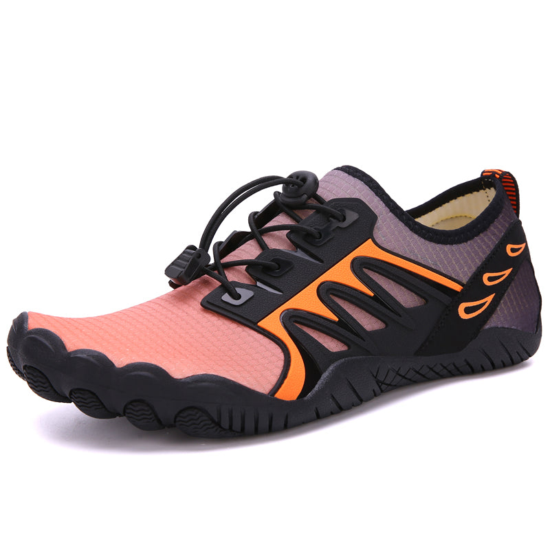 The Modalyst Barefoot Quick Dry Beach Pool Aqua Shoes for men feature a pink and black design with wavy soles, ideal for water activities. They include quick-drying materials, black accents, orange highlights, a pull-tab at the back, and elastic lace with a toggle closure for easy adjustment.