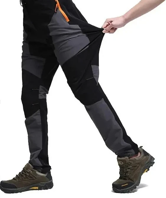 A person demonstrates the stretchability of Ten Essentials Men’s Quick-Dry Hiking Pants, featuring ultra-stretch fabric. The image highlights their light breathability, UV protection, and water-resistant properties with three color options displayed at the bottom.