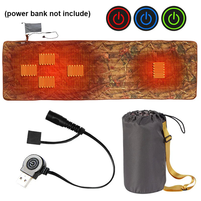 Image of the Ten Essentials USB Heated Sleeping Bag Pad with red-orange heating cables, powered by USB. Includes 3 power buttons: red, blue, green. Comes with a gray carry bag. Text above states power bank not included. Offers rapid heating and efficient warmth.