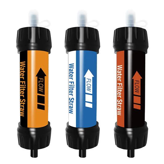 Three Ten Essentials Filterwell Mini straw filters in vibrant orange, blue, and black are displayed side by side. Each features Water Filter Straw, a flow direction arrow, and secure black caps on both ends, making them perfect for emergency preparedness.