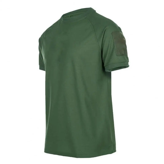 The Men’s Quick-Dry Military T-Shirt by Ten Essentials is a plain green, short-sleeve shirt with a round neckline and left sleeve patch pocket, made from lightweight, breathable, moisture-wicking fabric. It is displayed angled against a white background.