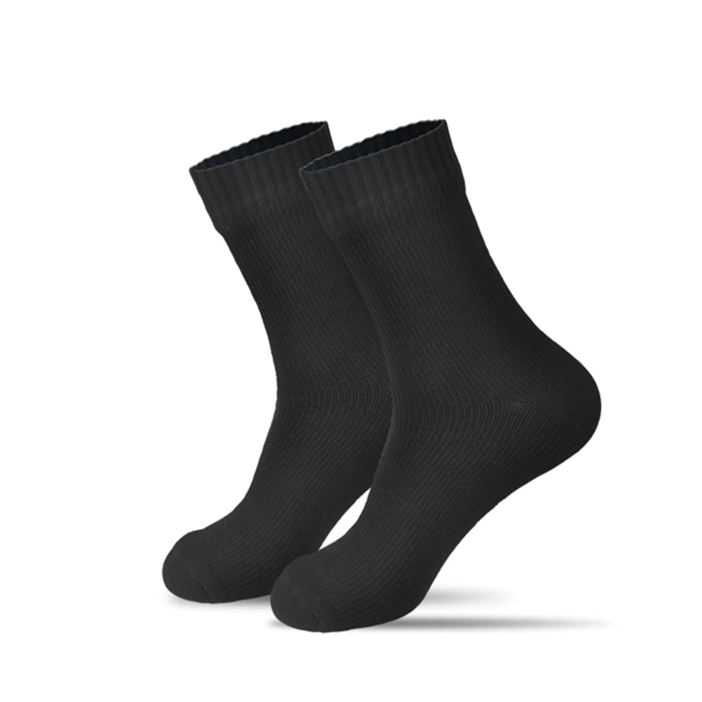 The black Waterproof Outdoor Sports Socks by Ten Essentials, standing against a plain white background, feature a textured ribbed surface. Ideal for hiking and skiing, they slightly elevate to highlight their durable shape.