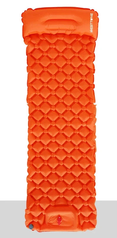 The Ten Essentials Ultralight Inflatable Camping Sleeping Pad, featuring a built-in pump and travel pillow, measures 190cm x 58cm unfolded and 27cm x 10cm packed. Weighing just 590g, this orange pad has durable waterproof materials and a textured surface with circular indentations.