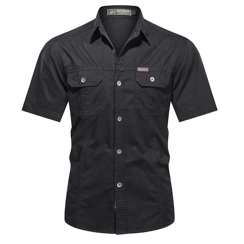 The Men’s Quick-Dry Tactical Shirt by Ten Essentials is a military-inspired, black short-sleeve button-up shirt with two chest pockets with flaps, a buttoned front closure, and collar. Made from breathable cotton for casual comfort, it is displayed on a plain white background.