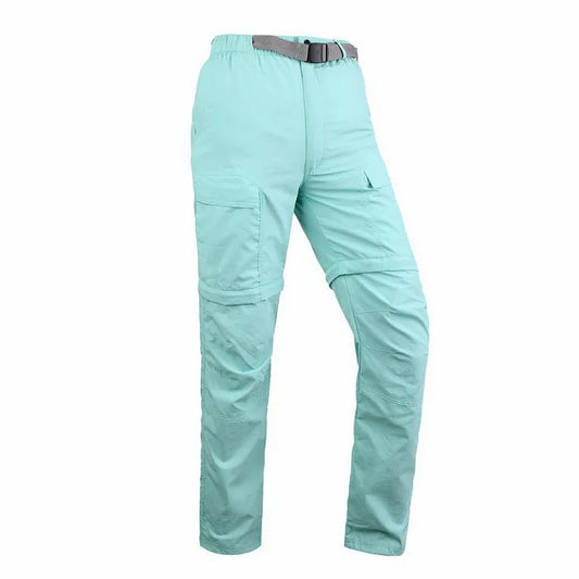 The NUONEKO Women’s Convertible Hiking Pants by Ten Essentials feature light teal quick-dry fabric, an elastic waistband, and built-in belt. Ideal for casual or outdoor activities, these straight-leg pants with multiple pockets ensure comfort and functionality.