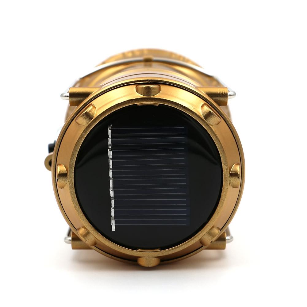 The eprolo LED Hand Lamp Rechargeable Collapsible Solar Camping Lantern is a cylindrical gold flashlight with a black solar panel on top. Its perfect for emergency kits, featuring energy-efficient charging and an industrial look with visible screws and detailing.