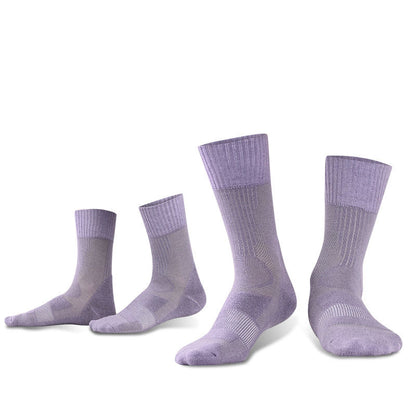 Four pairs of eprolo Outdoor Merino Wool Hiking Socks, purple and arranged from smallest to largest, stand upright. Identical in design with ribbed cuffs and a breathable pattern, they are set against a plain white background.