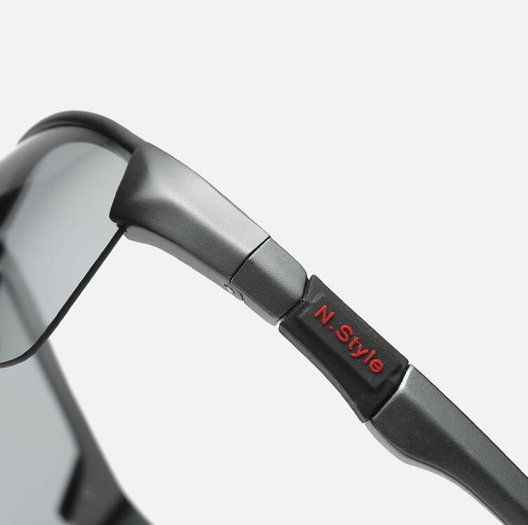 Close-up of eprolos Photochromic Sunglasses Polarized Chameleon for Men, featuring a sleek metallic frame and HD vision dark lenses. N. Style is printed in red on the arm, set against a light gray background to emphasize their advanced optics design.