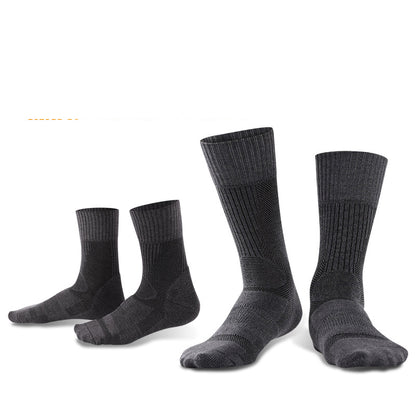 Two pairs of eprolo Outdoor Merino Wool Hiking Socks in dark gray, one smaller and one larger, stand upright on a plain white background. These breathable socks feature ribbed cuffs and reinforced heels and toes.