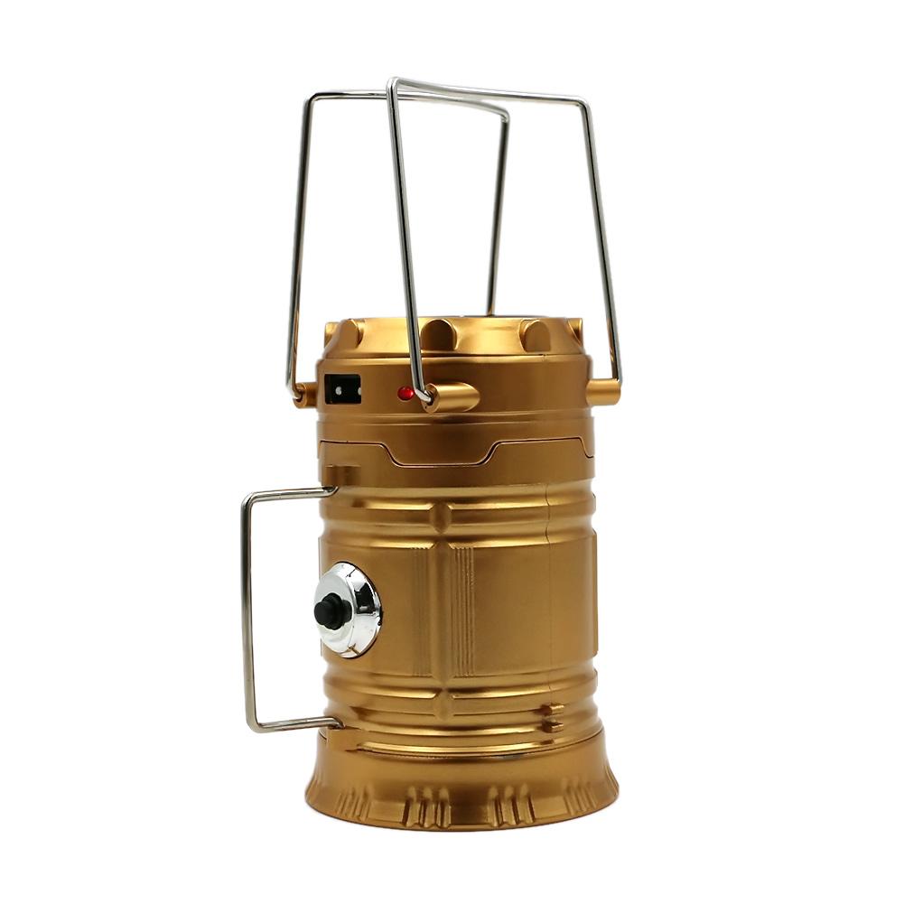 The eprolo LED Hand Lamp is a collapsible, gold-colored camping lantern with a silver handle and black side button. Equipped with foldable top and side handles, it has a cylindrical shape, metallic finish, and optional solar integration—perfect for an emergency kit.