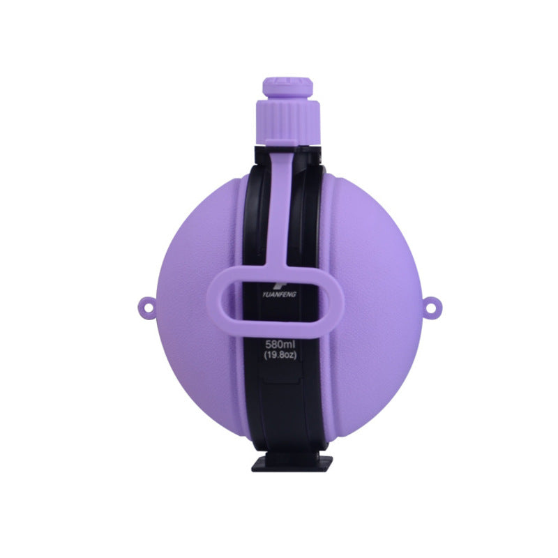 The eprolo Portable Silicone Folding Sports Water Bottle – 580m is made with food-grade silicone. This foldable, round bottle has a purple body, a black middle strap, and a screw-top cap. It holds 580ml (19.63oz) and features a collapsible design for easy storage.