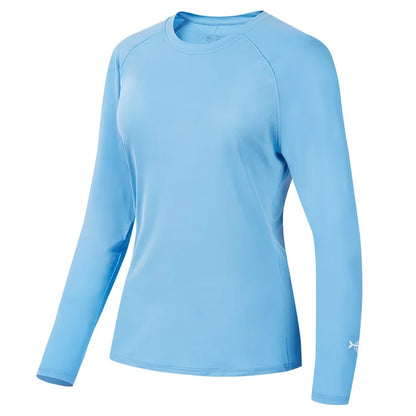 The Ten Essentials Bassdash Womens UPF 50+ Long Sleeve Performance Shirt, in light blue with a round neck, is shown on a white background. Made from smooth, lightweight fabric, it offers excellent sun protection and has a small logo near the wrist on the lower sleeve. Ideal for fishing and hiking.