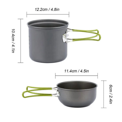 The Ten Essentials Camping Cookware Kit with Stove includes a pot and pan: the pot is 12.2 cm wide by 10.4 cm high, and the pan is 11.4 cm wide by 6 cm tall. Both have green folding handles, perfect for outdoor cooking on hikes or travels. Measurements are given in centimeters and inches.