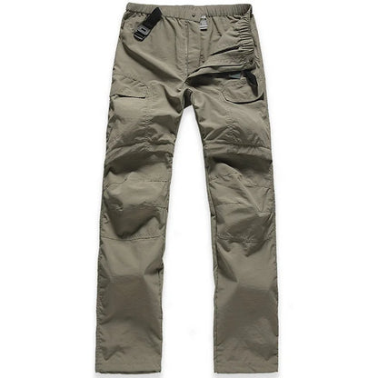 The NUONEKO Women’s Convertible Hiking Pants by Ten Essentials feature an olive green design with multiple pockets, adjustable waistband, reinforced knees, and a black plastic buckle. Made from quick-dry, water-resistant fabric, they’re ideal for outdoor activities with a zip fly and partially closed waist.