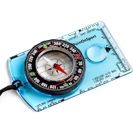 The Ten Essentials Waterproof Hiking & Camping Compass is a professional survival navigation tool with a transparent blue baseplate, rotating bezel, edge ruler, magnifying glass, and black lanyard. Its magnetic needle always points north.