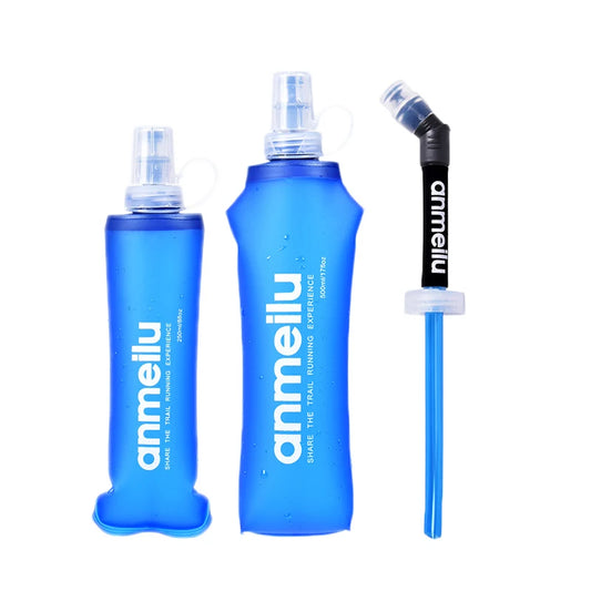 Three blue water bottles from Ten Essentials are displayed. Two are ultralight foldable soft flasks made from BPA-free TPU with spray nozzles and branding. The third is a slim bottle with a straw, ideal for outdoor adventures. All bottles feature sleek designs.