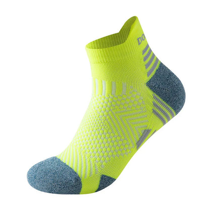 A Ten Essentials Professional Marathon Running Sock in neon yellow features a textured pattern with gray accents on the heel and toe, complemented by breathable mesh ventilation, set against a plain white background.