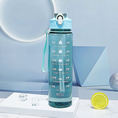 The Ten Essentials Sports Water Bottle with Time-Tracking & Leak-Proof Flip Cover (750-800ML) in blue features time markers from 8AM to 7PM and a straw, encouraging regular hydration. Motivational quotes Keep Chugging and You Did It inspire, complemented by ice cubes and a vibrant lemon slice for freshness.