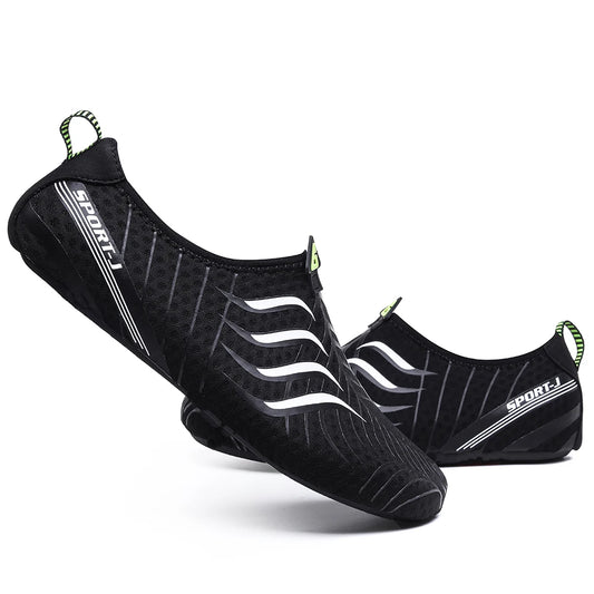 A pair of Ten Essentials Men’s Breathable Mesh Sneakers in black, with white wavy lines and a SPORT-I logo, featuring quick-dry fabric and green heel pull tabs. These lightweight non-slip hiking shoes offer a sporty design on a white backdrop.