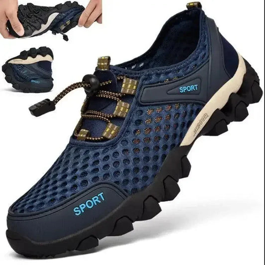 The Ten Essentials Men’s Breathable Mesh Sneakers, in navy blue with non-slip rubber soles and toggle lace design, feature SPORT. A smaller photo highlights the sneakers flexibility and lightweight nature, ideal for both hiking and casual wear.