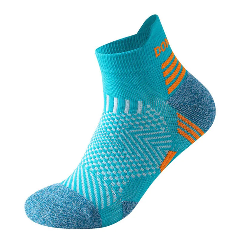 Introducing Ten Essentials Professional Marathon Running Socks – cushioned, low-cut sports ankle socks with blue and orange geometric zigzags and stripes. Featuring moisture-wicking technology and reinforced toe/heel for comfort/support, their vibrant design enhances the sporty look.