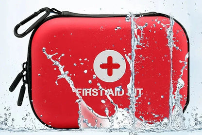 The Ten Essentials Portable First Aid Kit Bag, in red with a white cross and water droplets, is compact and designed for emergency preparedness. It features waterproof material with a black zipper and carabiner for easy attachment, meeting your medical storage needs at home or on the go.