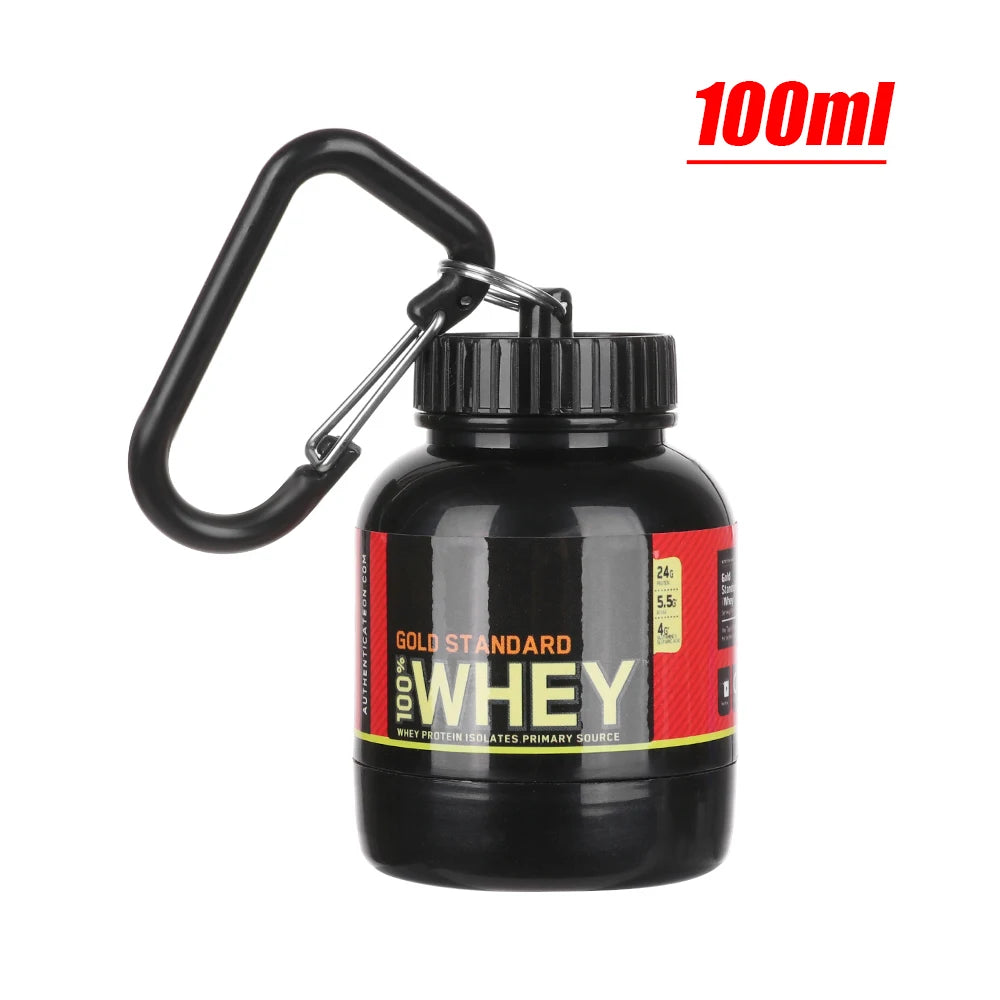 The Mini Portable Protein Powder Bottle by Ten Essentials is a sleek black 100ml travel accessory with a keychain. It features a red-and-yellow label displaying its nutritional info, ideal for fitness enthusiasts seeking convenience on-the-go.