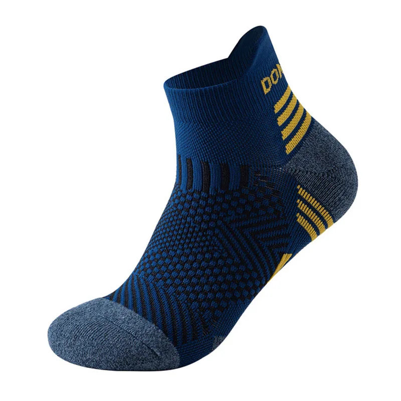 The Ten Essentials Professional Marathon Running Sock is a single dark blue, low-cut ankle sock with textured patterns and yellow stripe accents. It features breathable mesh ventilation, a grey toe and heel, and DON... branding near the cuff. Ideal for comfort against a white background.