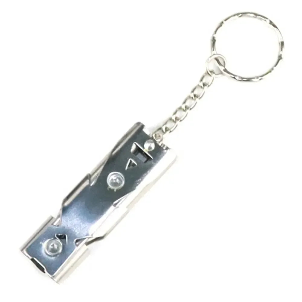 The Ten Essentials High-Decibel Double Pipe Survival Whistle is a durable metallic whistle with a sleek silver design, visible screws, and hole for easy attachment to a circular keychain linked by a short chain. Ideal for everyday use or emergency signaling against its plain white background.