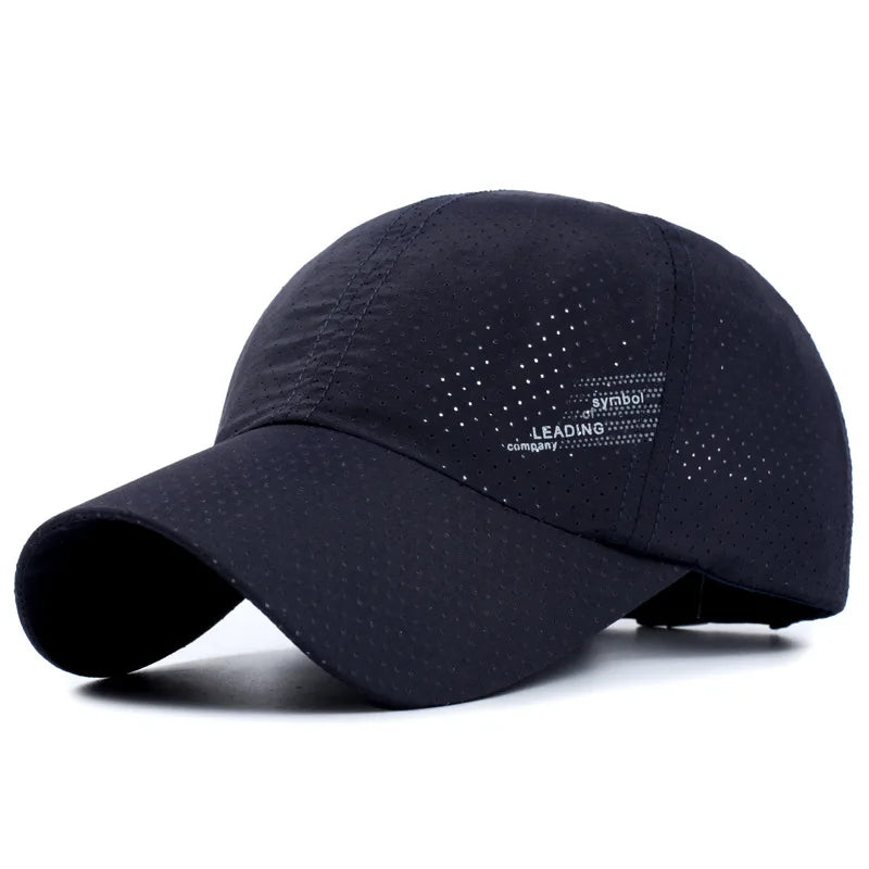 The Ten Essentials Quick-Dry Outdoor Sports Baseball Cap, shown on a white background, is black with breathable mesh, an adjustable fit, curved brim, and small perforations. It features subtle white text and symbols on the side, combining style with sun protection.