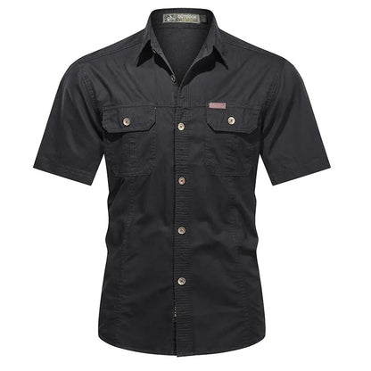 The Men’s Quick-Dry Tactical Shirt by Ten Essentials is a military-inspired, black short-sleeve button-up shirt with two chest pockets with flaps, a buttoned front closure, and collar. Made from breathable cotton for casual comfort, it is displayed on a plain white background.