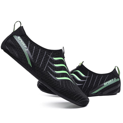 Ten Essentials offers Men’s Breathable Mesh Sneakers, featuring black designs with lime green and gray accents, a slip-on style with elastic bands. The word SPORT appears on the side. These lightweight barefoot sneakers feature quick-dry stretch fabric and non-slip EVA soles, ideal for aquatic activities.