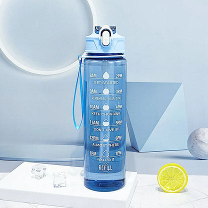The Ten Essentials Sports Water Bottle (750-800ML) with a leak-proof flip cover and motivational hourly markers from 8 AM to 8 PM rests on a minimalist blue and white background with a lemon slice, ensuring you stay refreshed all day.