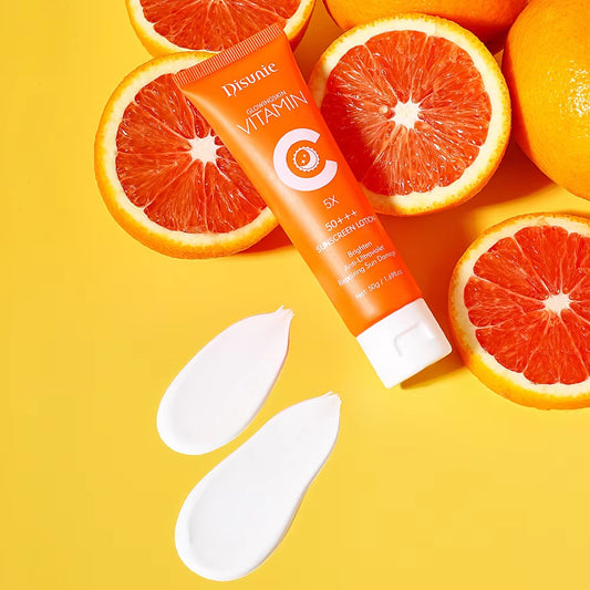An orange tube of Modalyst Sunscreen Cream SPF 50, featuring Vitamin C and collagen for brightening, sits on a yellow backdrop with halved oranges. Two creamy swatches in the foreground highlight its nourishing skin protection properties.